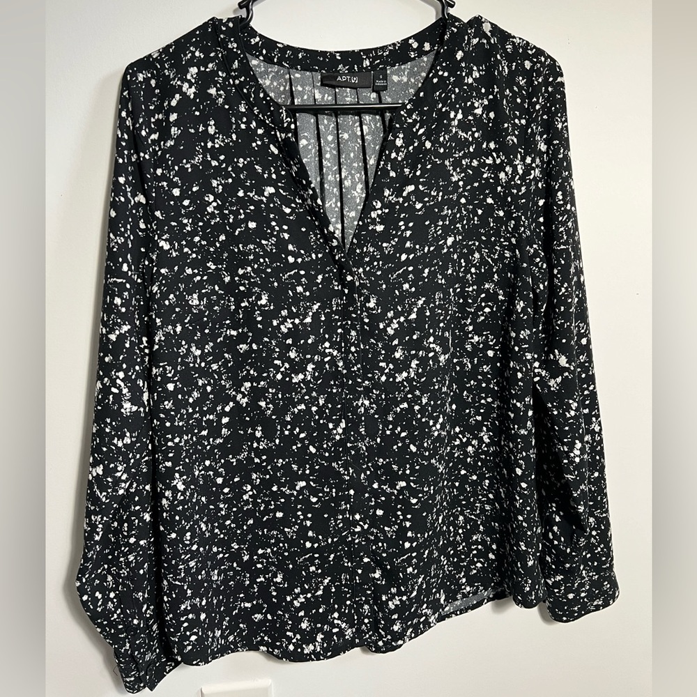 Speckled black and white top.